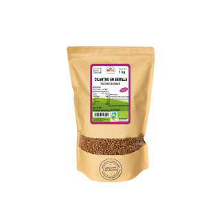 Bolsa de 1kg de Cilantro en semillas de la marca EcoAndes. El envase es de papel kraft con ventana transparente que muestra el contenido, etiqueta frontal con información nutricional, certificaciones ecológicas, sin gluten y sello de "envasado artesanal".