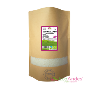 Bolsa de 1kg con contenido de Coco rallado de la marca EcoAndes. El envase es de papel kraft con ventana transparente que muestra el contenido, etiqueta frontal con información nutricional, certificaciones ecológicas, sin gluten y sello de "envasado artesanal".