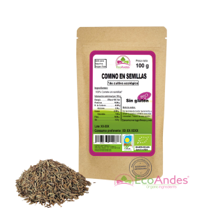 Bolsa de 100g de Comino en semillas de la marca EcoAndes. El envase es de papel kraft con ventana transparente que muestra el contenido, etiqueta frontal con información nutricional, certificaciones ecológicas, sin gluten y sello de "envasado artesanal".