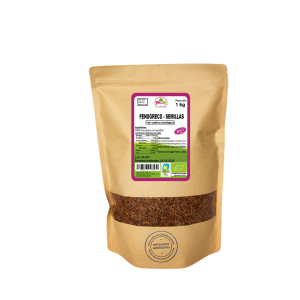 Bolsa de 1kg de Fenogreco en semillas de la marca EcoAndes. El envase es de papel kraft con ventana transparente que muestra el contenido, etiqueta frontal con información nutricional, certificaciones ecológicas, sin gluten y sello de "envasado artesanal".