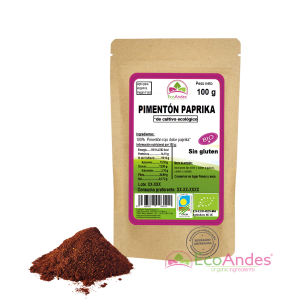 Bolsa de 100g de Pimentón dulce paprika en polvo de la marca EcoAndes. El envase es de papel kraft con ventana transparente que muestra el contenido, etiqueta frontal con información nutricional, certificaciones ecológicas, sin gluten y sello de "envasado artesanal".