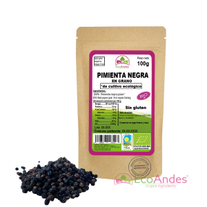 Bolsa de 100g de Pimienta negra en grano de la marca EcoAndes. El envase es de papel kraft con ventana transparente que muestra el contenido, etiqueta frontal con información nutricional, certificaciones ecológicas, sin gluten y sello de "envasado artesanal".