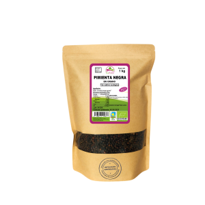 Bolsa de 1kg de Pimienta negra en grano de la marca EcoAndes. El envase es de papel kraft con ventana transparente que muestra el contenido, etiqueta frontal con información nutricional, certificaciones ecológicas, sin gluten y sello de "envasado artesanal".