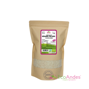 Bolsa de 1kg con contenido de semillas de sésamo pelado blanco de la marca EcoAndes. El envase es de papel kraft con ventana transparente que muestra el contenido, etiqueta frontal con información nutricional, certificaciones ecológicas, sin gluten y sello de "envasado artesanal".
