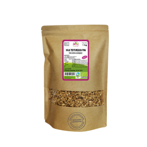 Bolsa de 1kg de Soja texturizada fina de la marca EcoAndes. El envase es de papel kraft con ventana transparente que muestra el contenido, etiqueta frontal con información nutricional, certificaciones ecológicas, sin gluten y sello de "envasado artesanal".